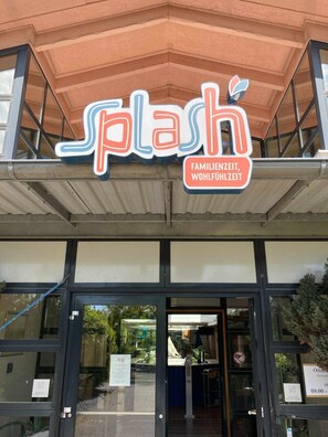 A storefront with a sign reading "Splash" and a smaller sign indicating "Family Time, Leisure Time."