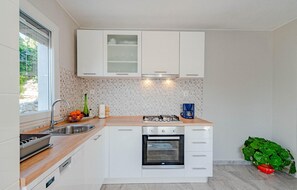 Fridge, stovetop, dishwasher, coffee/tea maker