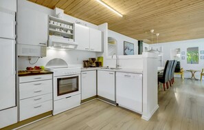 Fridge, stovetop, dishwasher, coffee/tea maker