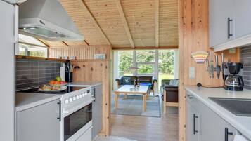 Fridge, stovetop, dishwasher, coffee/tea maker