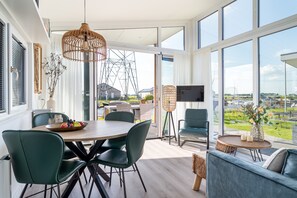 Chalet, 2 Bedrooms, Canal View (Knilles 4 aan het water) | Living area | Flat-screen TV - Recreatiepark Tusken de Marren (Akkrum)