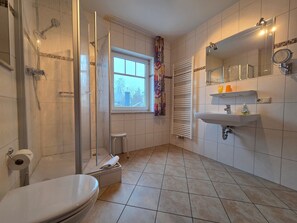 Shower, hair dryer, towels, soap