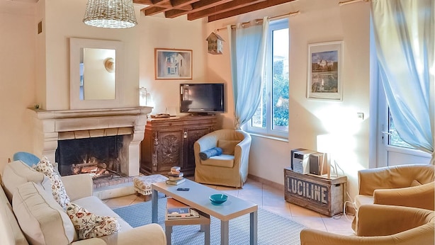 A cozy living room with a fireplace, comfortable seating, a television, and artwork on the walls. - 2 bedroom lovely home in Trie-Château (Trie-Château)