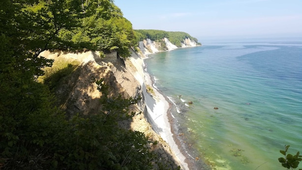 A coastal landscape with cliffs and a clear view of the sea.