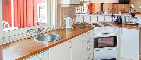 Fridge, stovetop, dishwasher, coffee/tea maker