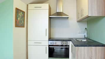 Een koelkast, een oven, een vaatwasser