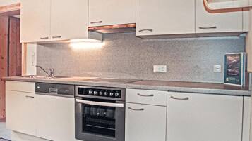 Fridge, stovetop, dishwasher, coffee/tea maker