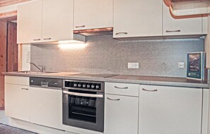 Fridge, stovetop, dishwasher, coffee/tea maker