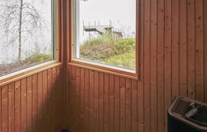 A corner room with wooden walls and a window. - Lovely home in Skånes Fagerhult (Skånes Fagerhult)