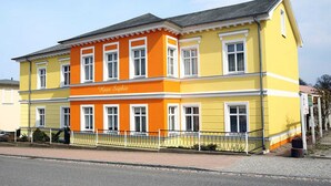 A two-story building with the name "Haus Sophie" on the facade.