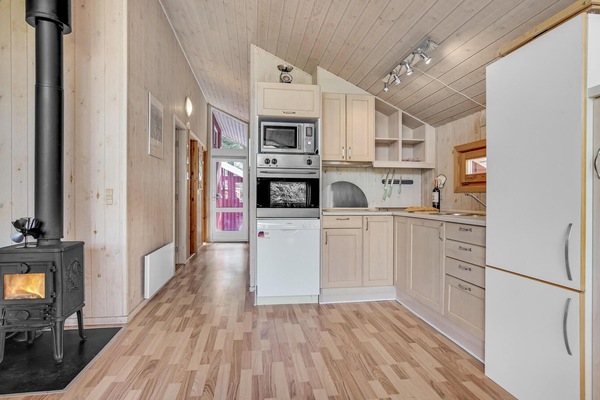 Fridge, stovetop, dishwasher, coffee/tea maker