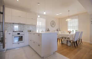 Fridge, stovetop, dishwasher, coffee/tea maker