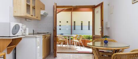 Fridge, microwave, stovetop, coffee/tea maker