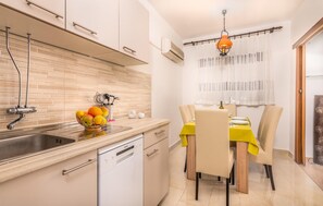 Fridge, stovetop, dishwasher, coffee/tea maker