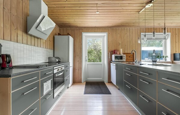 Fridge, stovetop, dishwasher, coffee/tea maker