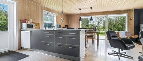 Fridge, stovetop, dishwasher, coffee/tea maker