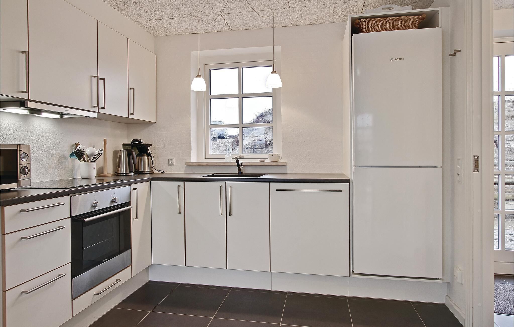 Fridge, stovetop, dishwasher, coffee/tea maker