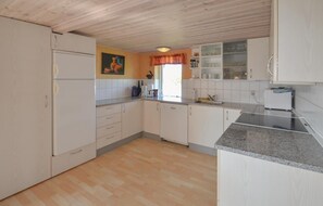 Fridge, stovetop, dishwasher, coffee/tea maker