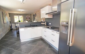 Fridge, stovetop, dishwasher, coffee/tea maker
