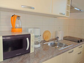Fridge, microwave, stovetop, cookware/dishes/utensils