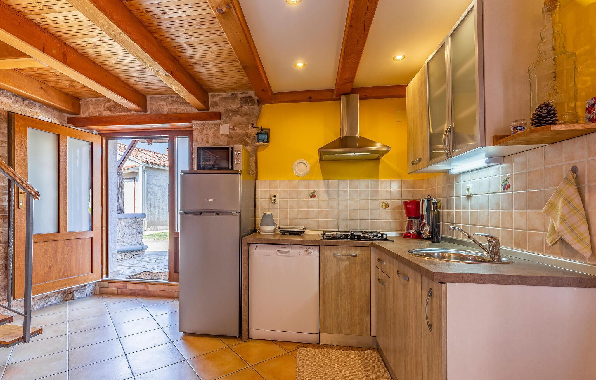 Fridge, stovetop, dishwasher, coffee/tea maker