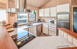 Fridge, stovetop, dishwasher, coffee/tea maker