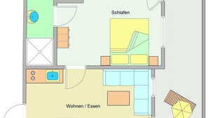 A floor plan with a balcony, a bathroom, a living area, and a dining space.
