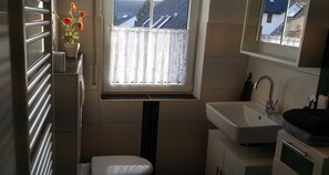 Shower, hair dryer, towels, toilet paper