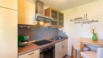 Fridge, oven, cookware/dishes/utensils