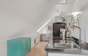 Fridge, microwave, coffee/tea maker, cookware/dishes/utensils