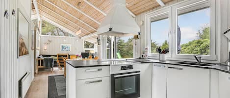 Fridge, stovetop, dishwasher, coffee/tea maker
