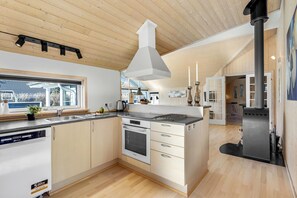 Fridge, stovetop, dishwasher, coffee/tea maker