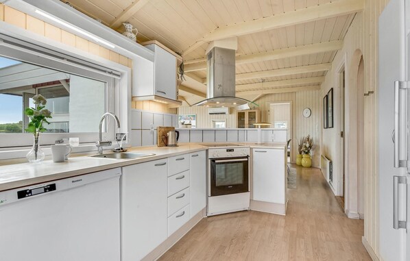 Fridge, stovetop, dishwasher, coffee/tea maker