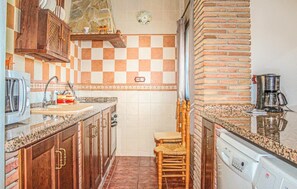 Fridge, stovetop, dishwasher, coffee/tea maker
