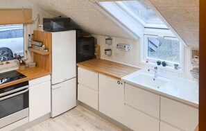 Fridge, stovetop, dishwasher, coffee/tea maker