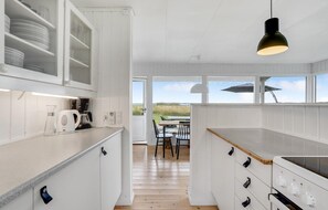 Fridge, stovetop, dishwasher, coffee/tea maker