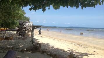 On the beach, sun loungers, snorkeling, beach bar