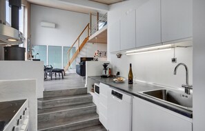 Fridge, stovetop, dishwasher, coffee/tea maker