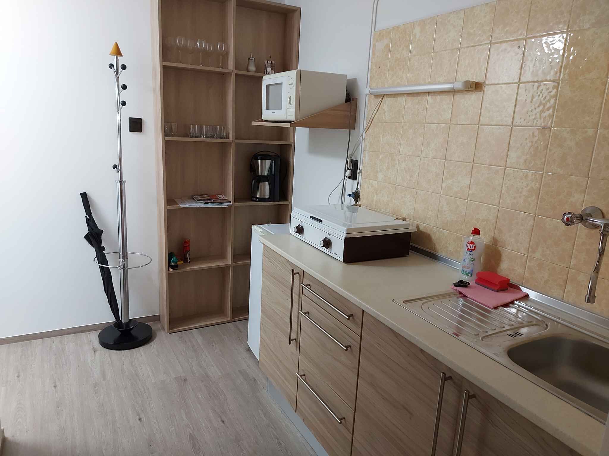 Fridge, microwave, stovetop, coffee/tea maker