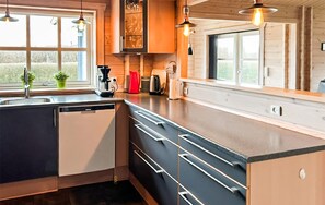 Fridge, stovetop, dishwasher, coffee/tea maker