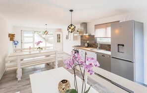 Fridge, stovetop, dishwasher, coffee/tea maker