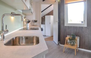 Fridge, stovetop, dishwasher, coffee/tea maker