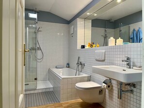 Shower, hair dryer, towels, soap