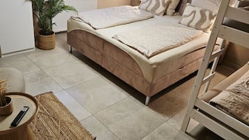 Family Room (1) | Down comforters, blackout drapes, free WiFi, bed sheets