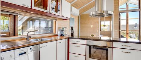 Fridge, stovetop, dishwasher, coffee/tea maker