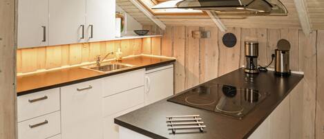 Fridge, stovetop, dishwasher, coffee/tea maker