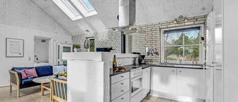 Fridge, stovetop, dishwasher, coffee/tea maker