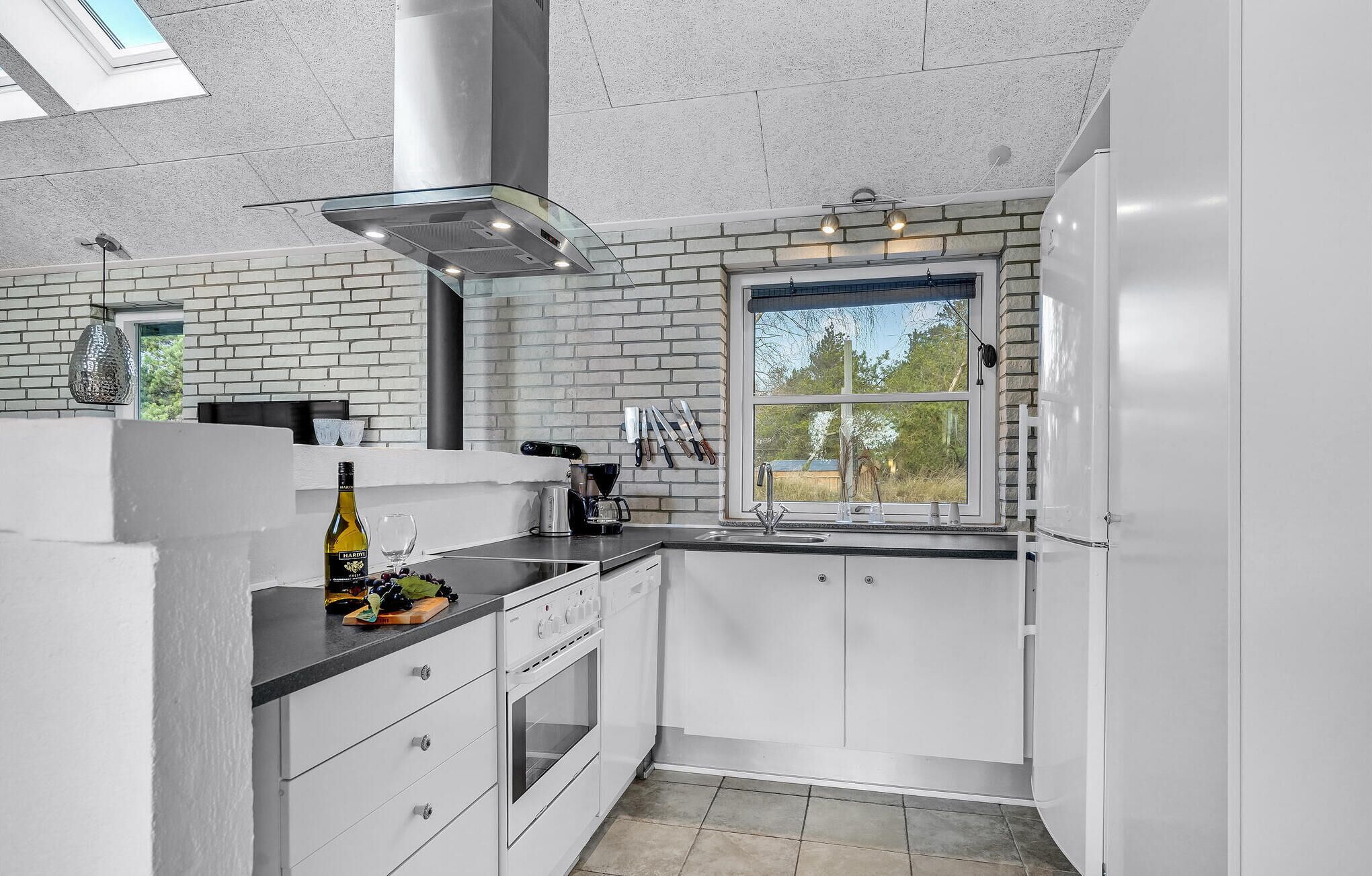 Fridge, stovetop, dishwasher, coffee/tea maker