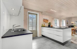 Fridge, stovetop, dishwasher, coffee/tea maker