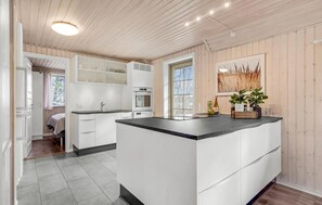 Fridge, stovetop, dishwasher, coffee/tea maker